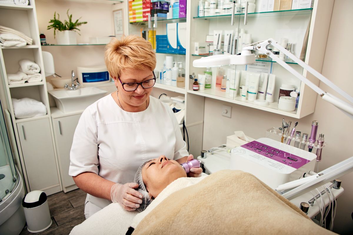 beautician using facial cryotherapy massager in co 2025 03 24 11 27 00 utc